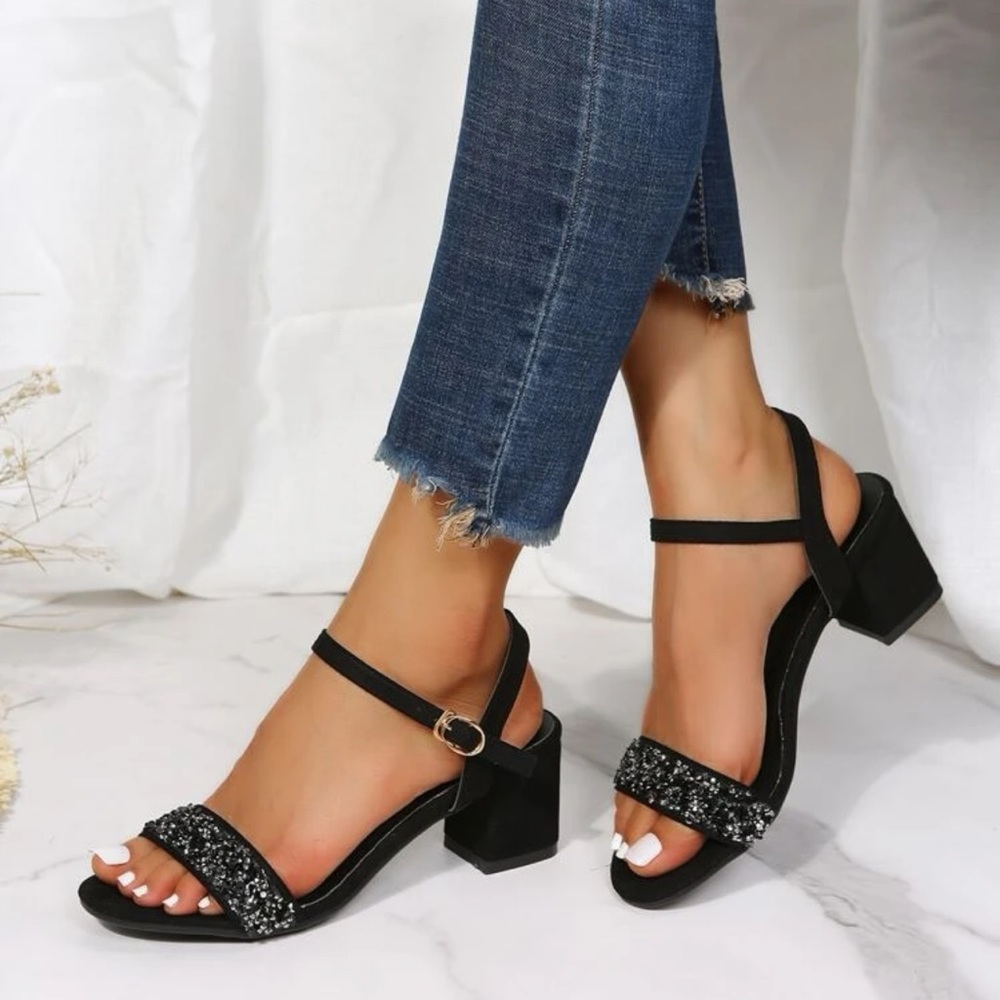 Chunky sandal with ankle strap and sequins over the open toe. Perfect party heel